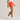 side view of model wearing authentic soffe shorts orange color